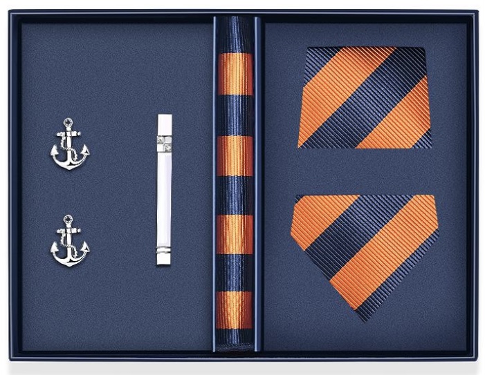 Cravate bleu de nuit rayures orange - Le coffret comprends: une cravate, un mouchoir , une pince et des boutons manchettes 